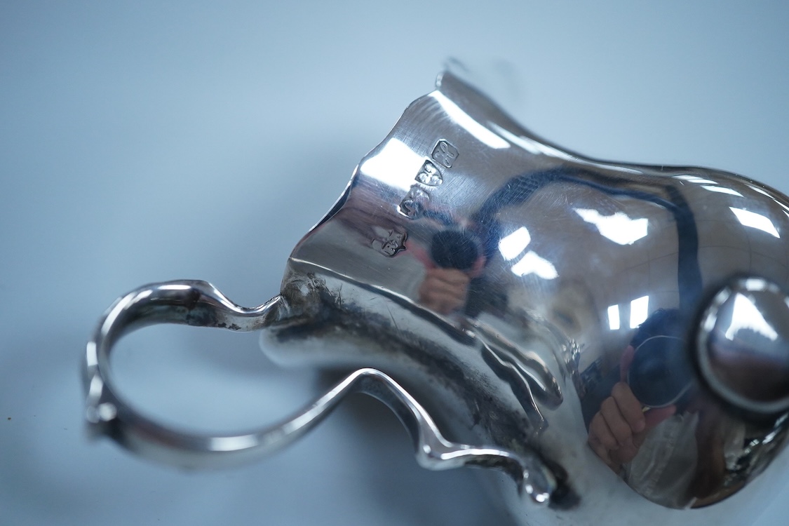 Small silver including a three piece cruet set, by George Howson, Sheffield, 1924/5/6, a napkin ring, a cream jug and a set of six 830s coffee spoons.